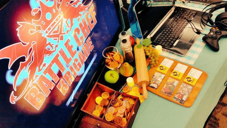 Clavier, manette, pièces de monnaie, fruits et éléments de jeu sur une table pour une soirée jeux vidéo.
