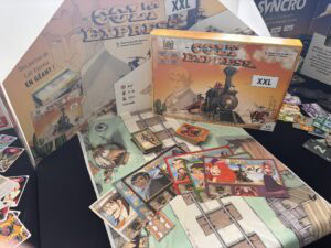 Colt Express jeu de société sur le train vintage, boîte XXL, illustrations colorées, composants de jeu, cartes personnages et plateau détaillé, parfait pour les amateurs de jeux de société à thème western et aventure.