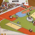 Joueur de jeu de société Air-Gaming avec face à un terrain de sport pour enfants, illustration colorée et animée, idéale pour famille et amusement en intérieur.