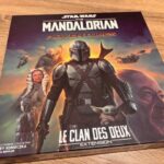 Star Wars The Mandalorian aventures jeu de société en extension, illustré avec le personnage principal Mandalorian, bébé Yoda, et d'autres personnages, idéal pour fans de jeux de stratégie et de la saga Star Wars.