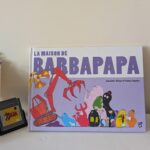 Couverture du livre La Maison de Barbapapa avec personnages colorés et une maison en arrière-plan, illustrant l'univers de Barbapapa pour enfants.