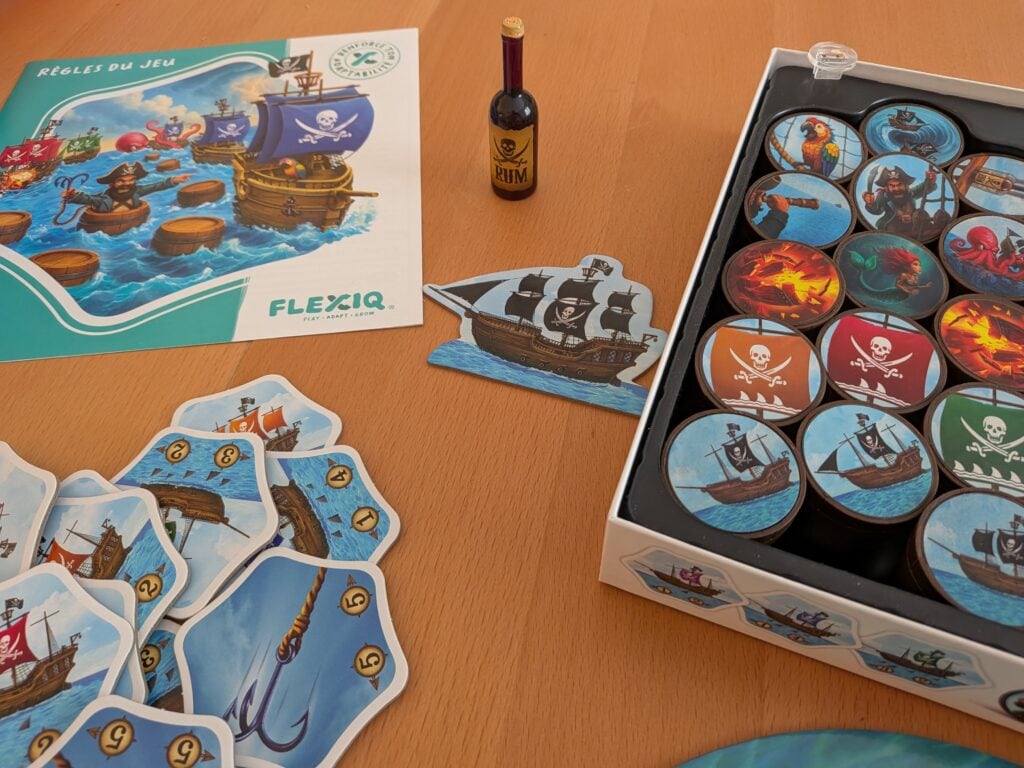 Jeu de société Pirates et trésors avec pièces de jeu, bateau en carton et règle du jeu pour enfants et adultes.