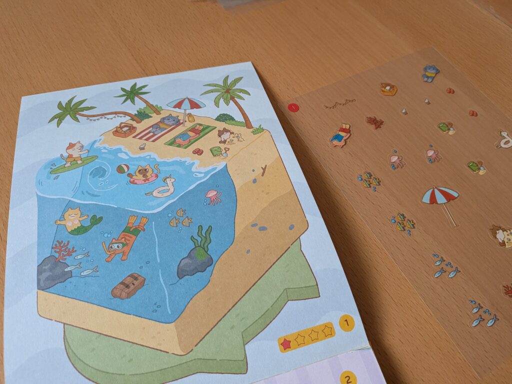 Jeu de stickers pour enfants avec scène de plage et animaux marins.