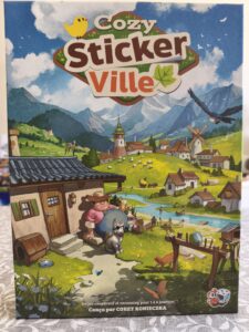 Illustration de Cozy Stickers Ville avec paysages de montagne, village, animaux et personnages dans un style coloré et accueillant.